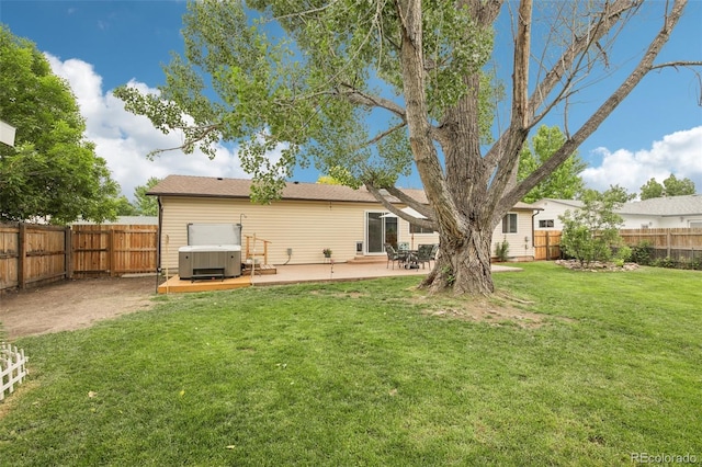 7075 Welch Ct, Arvada, CO 80004 - back of house featuring a hot tub and a patio area