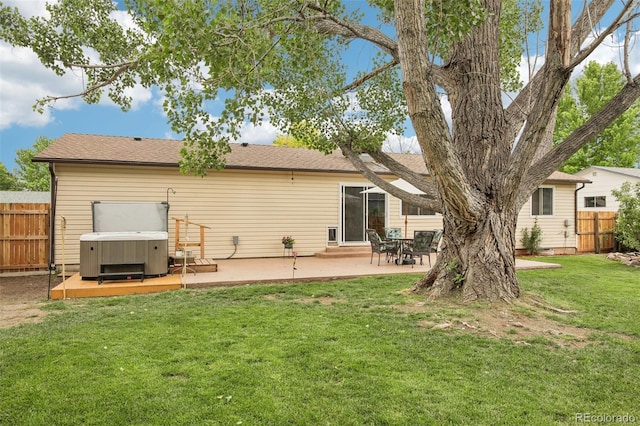 7075 Welch Ct, Arvada, CO 80004 - back of house with a hot tub and a patio area
