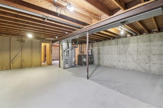 7075 Welch Ct, Arvada, CO 80004 - unfinished below grade area featuring independent washer and dryer and heating unit