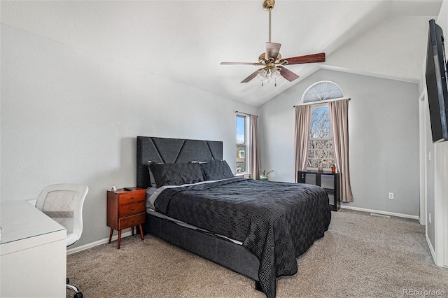 bedroom with ceiling fan, vaulted ceiling, and carpet