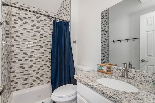 bathroom with vanity, toilet, and a shower with shower curtain