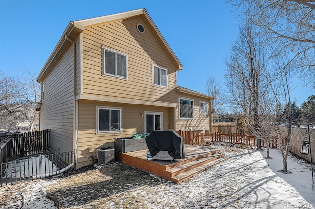 snow covered house with cooling unit