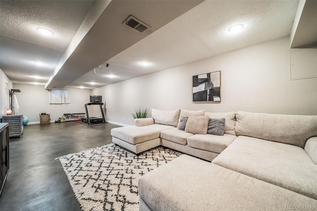 18159 E Crestline Cir, Centennial, CO 80015 - living area with finished concrete flooring, a textured ceiling, and recessed lighting