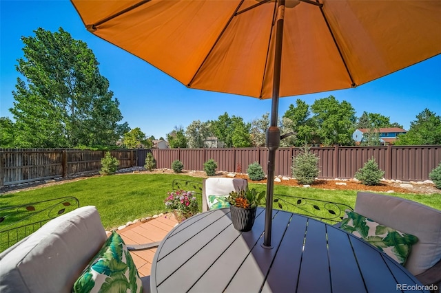 18159 E Crestline Cir, Centennial, CO 80015 - wooden terrace with outdoor dining space and a fenced backyard