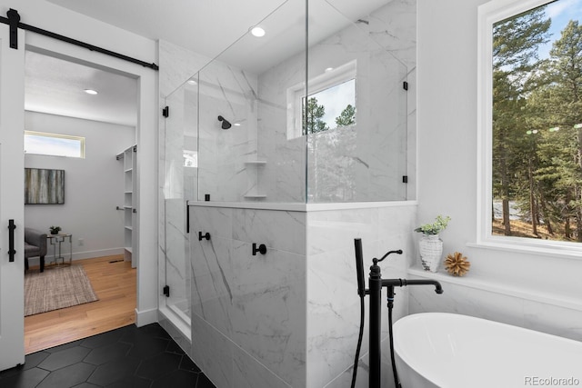 bathroom featuring tile patterned floors and shower with separate bathtub