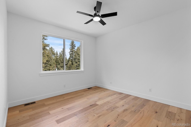 unfurnished room with ceiling fan and light hardwood / wood-style flooring