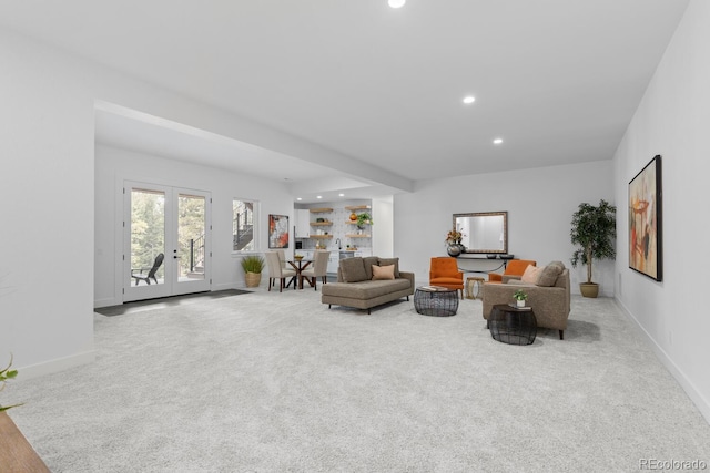 living room with light carpet and french doors