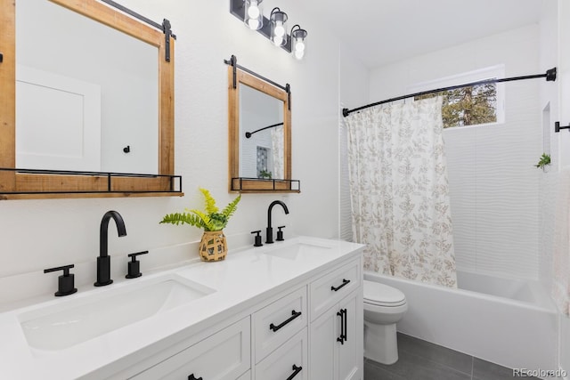 full bathroom featuring vanity, shower / bath combination with curtain, tile patterned floors, and toilet