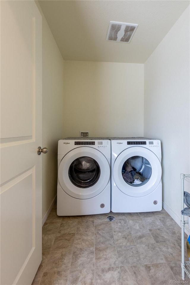 236 Racer St, Bennett, CO 80102 - laundry area with visible vents, baseboards, washer and dryer, and laundry area
