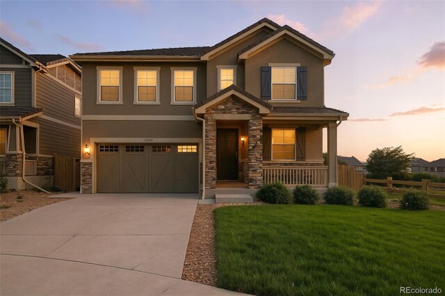 12554 Hudson Ct, Thornton, CO 80241 - craftsman-style home featuring stucco siding, driveway, and covered porch