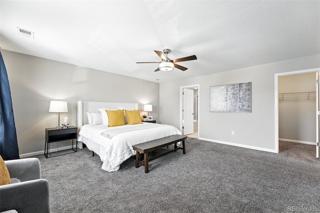 12554 Hudson Ct, Thornton, CO 80241 - bedroom with carpet floors, a walk in closet, and a ceiling fan