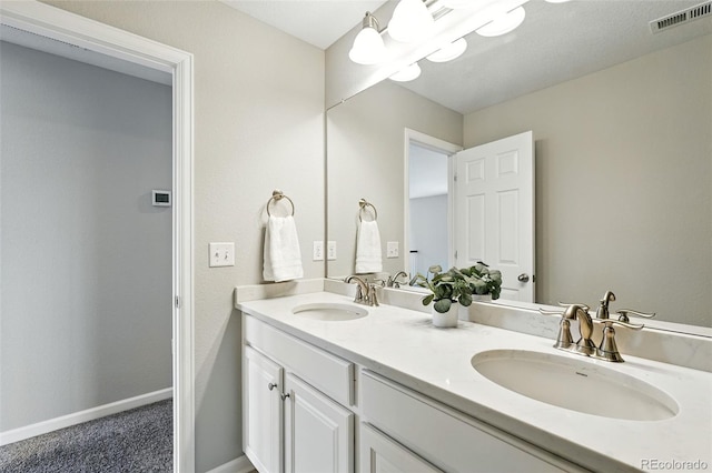 12554 Hudson Ct, Thornton, CO 80241 - bathroom with double vanity and baseboards