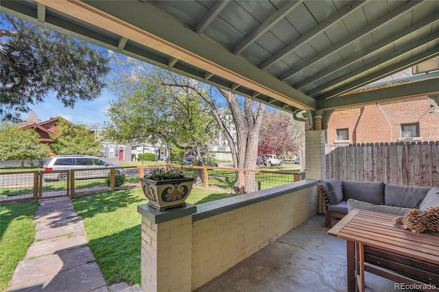 view of patio with fence and a gate