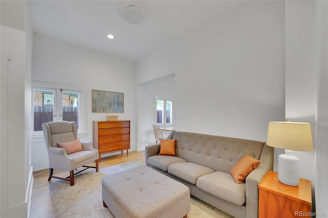 living area featuring plenty of natural light, recessed lighting, and light wood-style flooring