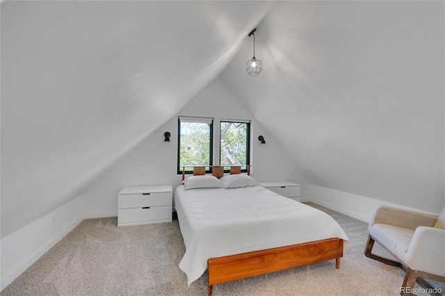 bedroom featuring carpet flooring, baseboards, and vaulted ceiling