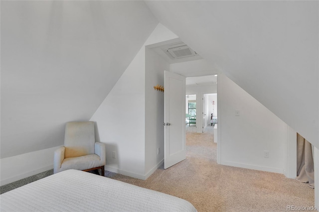 carpeted bedroom with baseboards, vaulted ceiling, and visible vents