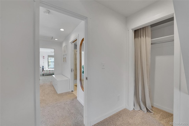 corridor with baseboards, light carpet, and recessed lighting