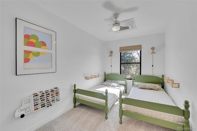 bedroom featuring baseboards, a ceiling fan, and carpet