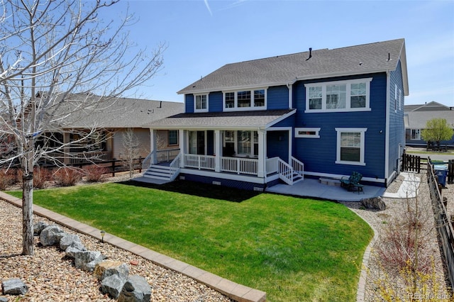 rear view of property with a patio, fence, roof with shingles, and a lawn