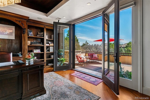 doorway featuring recessed lighting, french doors, and light wood-style flooring