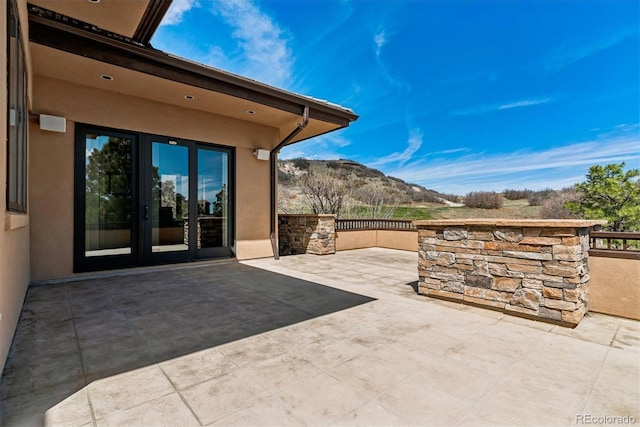view of patio featuring french doors