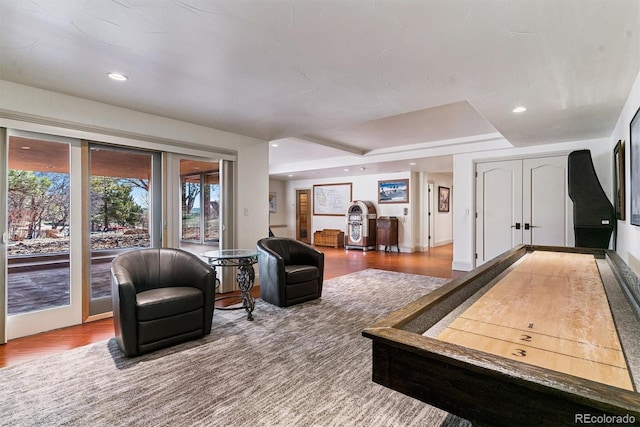 game room with wood finished floors and recessed lighting