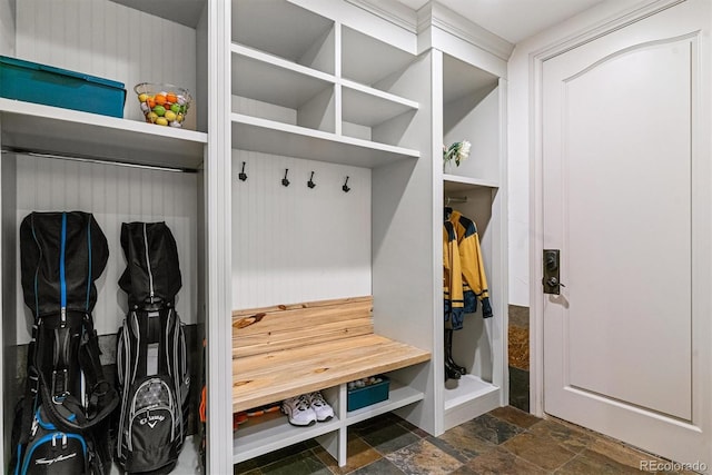 mudroom featuring stone finish floor