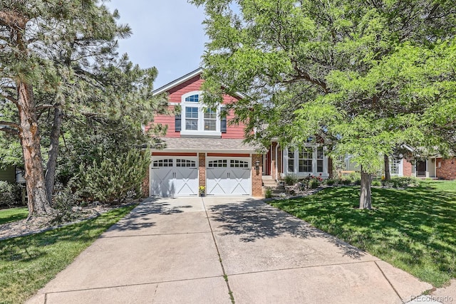 7445 Shoreham Pl, Castle Pines, CO 80108 - view of front of property with brick siding, driveway, a garage, and a front yard