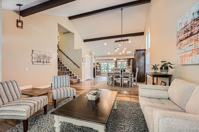 7445 Shoreham Pl, Castle Pines, CO 80108 - living room featuring light wood finished floors, beam ceiling, high vaulted ceiling, stairway, and recessed lighting