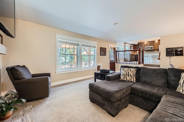 7445 Shoreham Pl, Castle Pines, CO 80108 - carpeted living room featuring baseboards