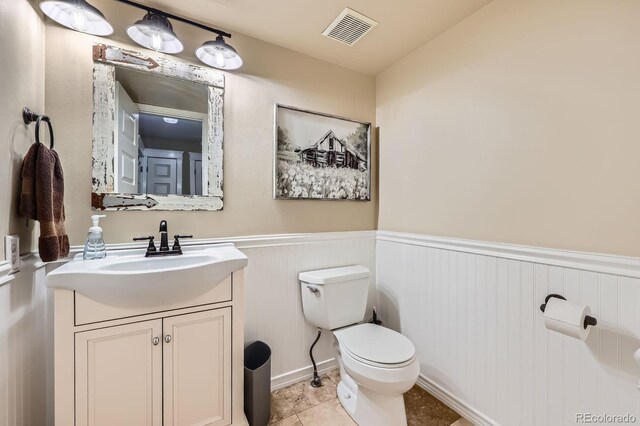 7445 Shoreham Pl, Castle Pines, CO 80108 - bathroom with a wainscoted wall and vanity