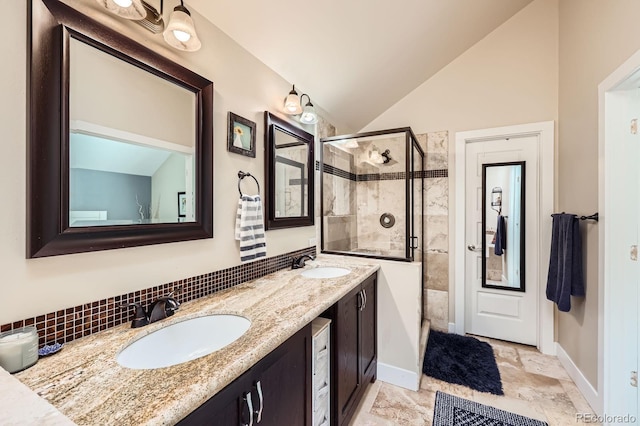 7445 Shoreham Pl, Castle Pines, CO 80108 - full bath featuring a stall shower, double vanity, lofted ceiling, stone finish flooring, and decorative backsplash
