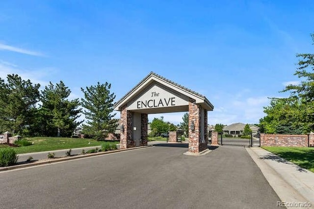 9561 Silver Hill Cir, Lone Tree, CO 80124 - view of asphalt street featuring a gate, a gated entry, and curbs