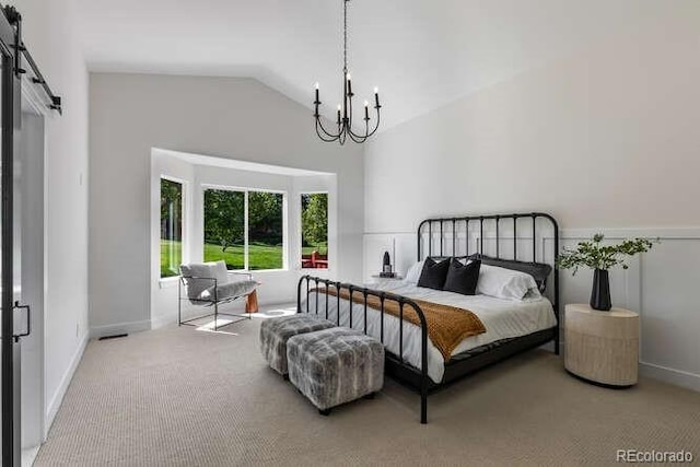 9561 Silver Hill Cir, Lone Tree, CO 80124 - bedroom featuring a chandelier, carpet, a barn door, and high vaulted ceiling