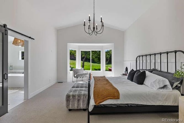 9561 Silver Hill Cir, Lone Tree, CO 80124 - bedroom featuring carpet, a barn door, a chandelier, high vaulted ceiling, and ensuite bathroom