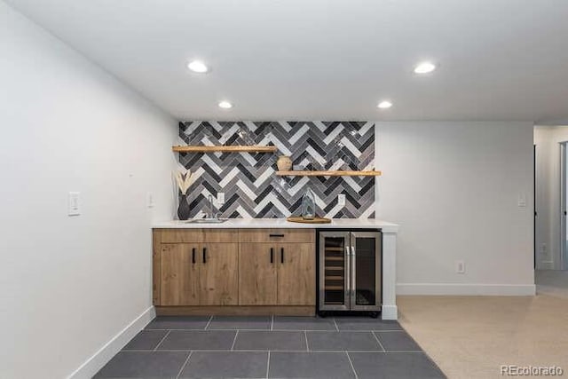 9561 Silver Hill Cir, Lone Tree, CO 80124 - indoor dry bar with beverage cooler, recessed lighting, and dark tile patterned floors