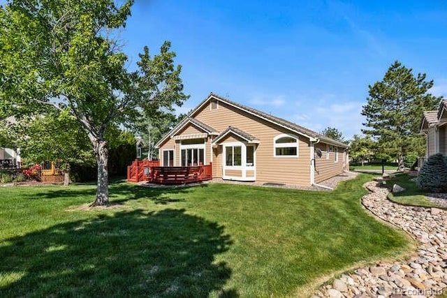 9561 Silver Hill Cir, Lone Tree, CO 80124 - back of house featuring a wooden deck and a lawn