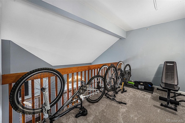 exercise room with carpet and vaulted ceiling