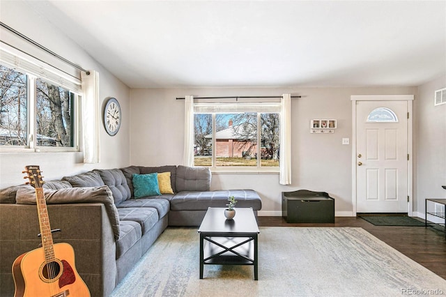 living room with dark hardwood / wood-style flooring