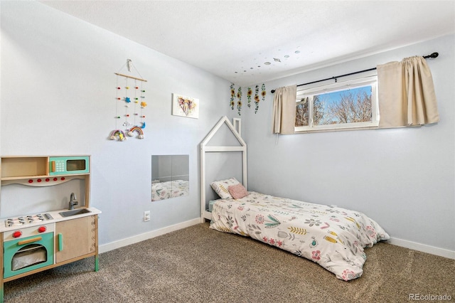 bedroom with sink and carpet