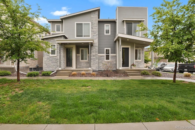 23615 E 5th Pl, Aurora, CO 80018 - view of front of property with stone siding and a front yard