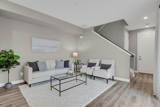 23615 E 5th Pl, Aurora, CO 80018 - living room featuring stairs, baseboards, and wood finished floors