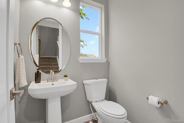 23615 E 5th Pl, Aurora, CO 80018 - bathroom featuring toilet and baseboards