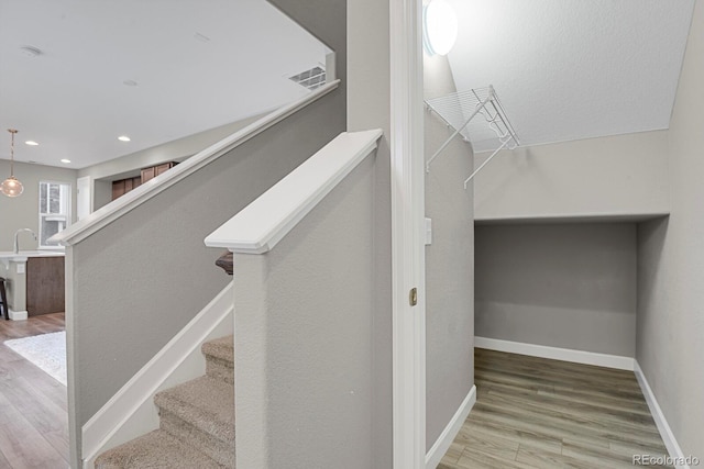 23615 E 5th Pl, Aurora, CO 80018 - stairs with wood finished floors, baseboards, and recessed lighting
