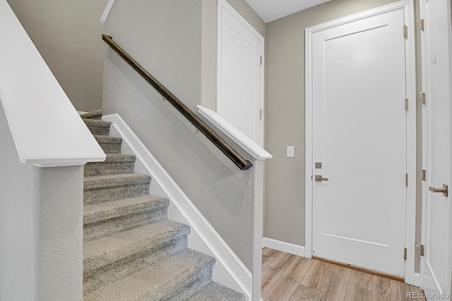 23615 E 5th Pl, Aurora, CO 80018 - stairway featuring wood finished floors and baseboards