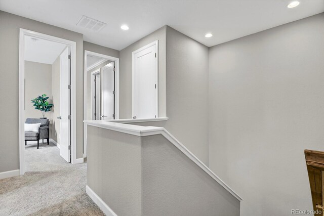 23615 E 5th Pl, Aurora, CO 80018 - hallway featuring light carpet, baseboards, and recessed lighting