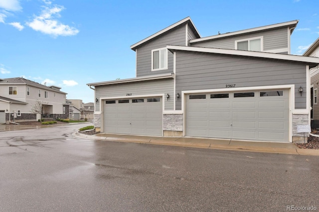 23615 E 5th Pl, Aurora, CO 80018 - view of front of property featuring stone siding and a residential view