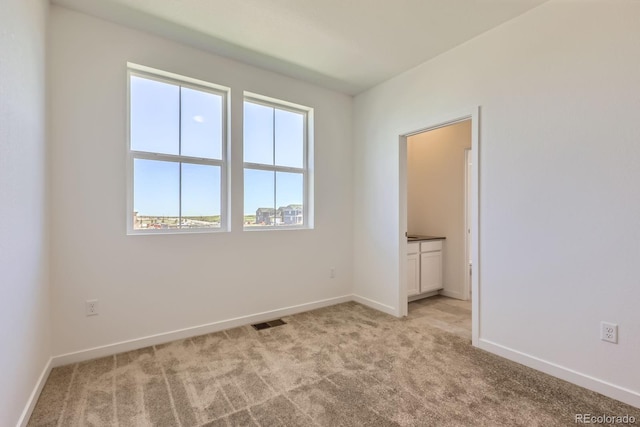752 N Bently St, Watkins, CO 80137 - empty room with light carpet and baseboards