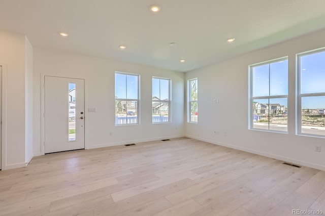 752 N Bently St, Watkins, CO 80137 - unfurnished living room featuring light wood-style floors and recessed lighting