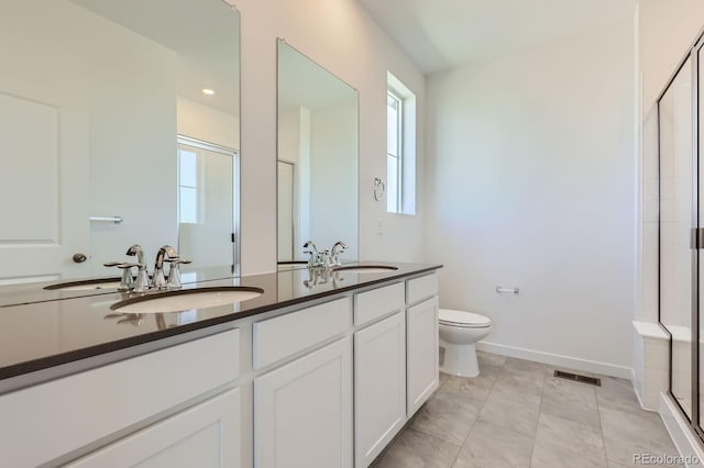 752 N Bently St, Watkins, CO 80137 - bathroom featuring a stall shower and double vanity